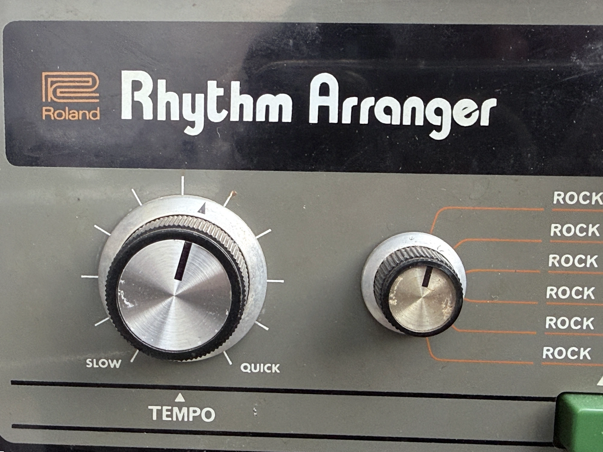 Close view of the Roland Rhythm Arranger identity script and tempo controls on the TR-66