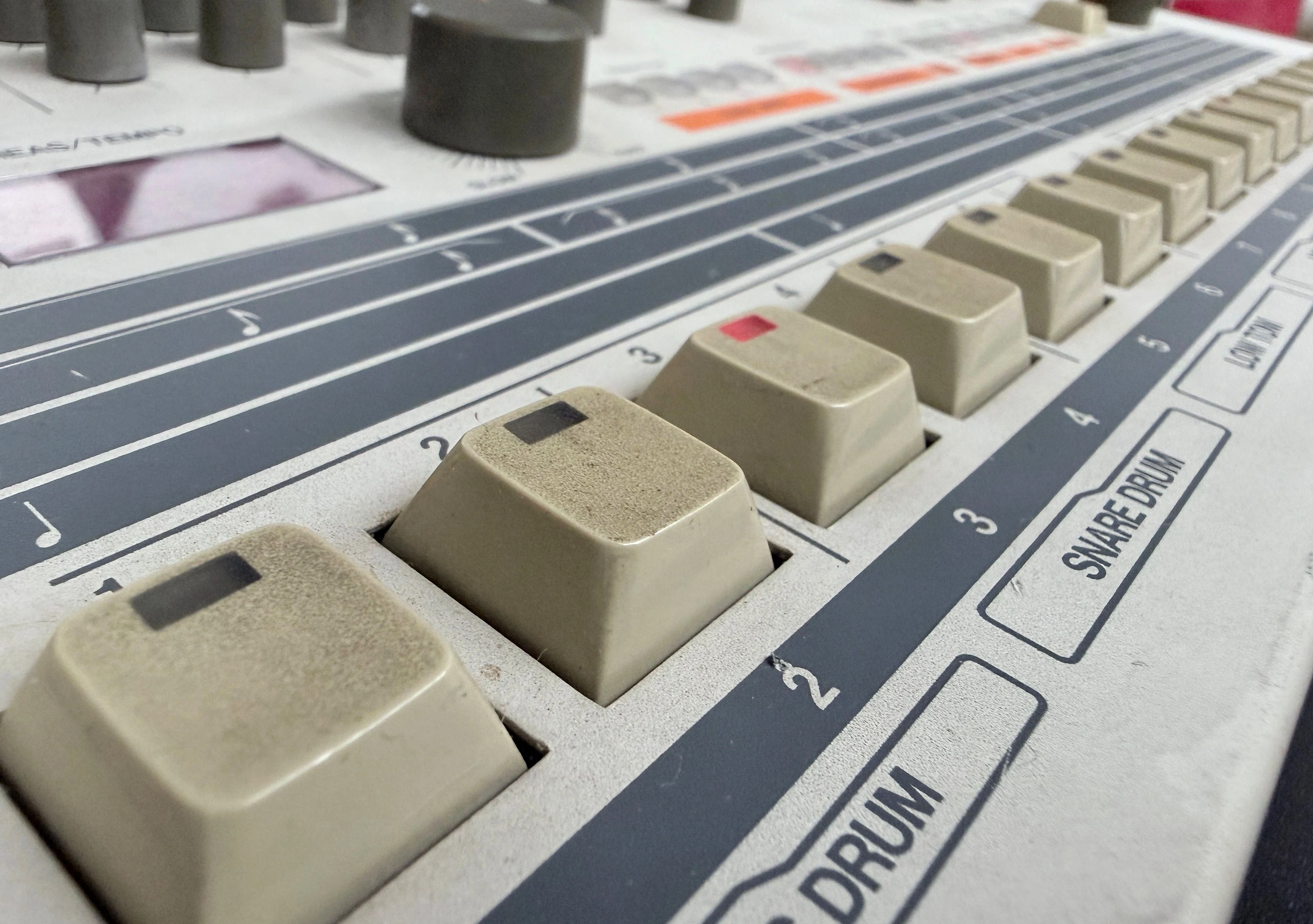 Close owner photograph of the TR-909 step keys and scale controls