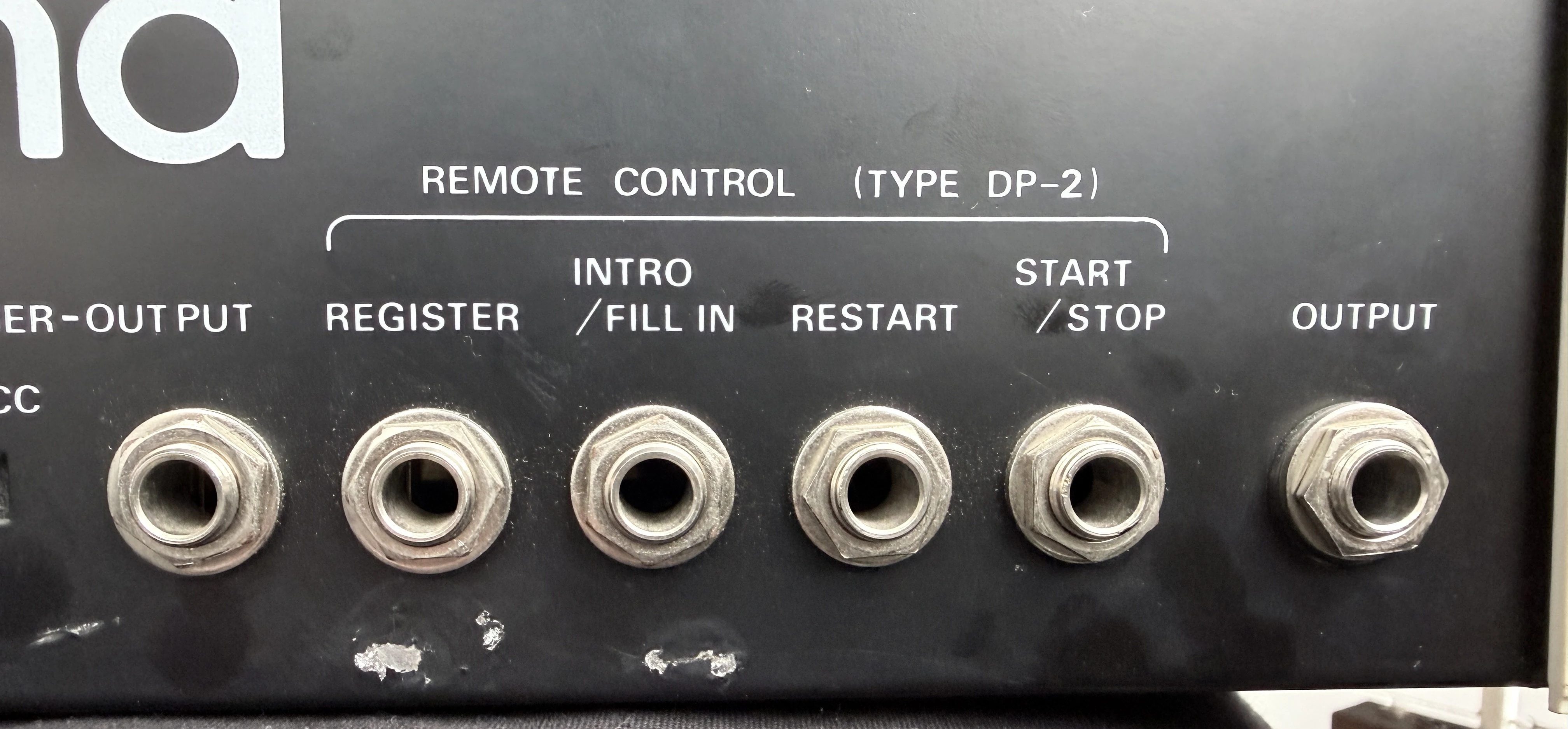 CR-8000 rear-panel detail showing remote-control inputs and audio outputs