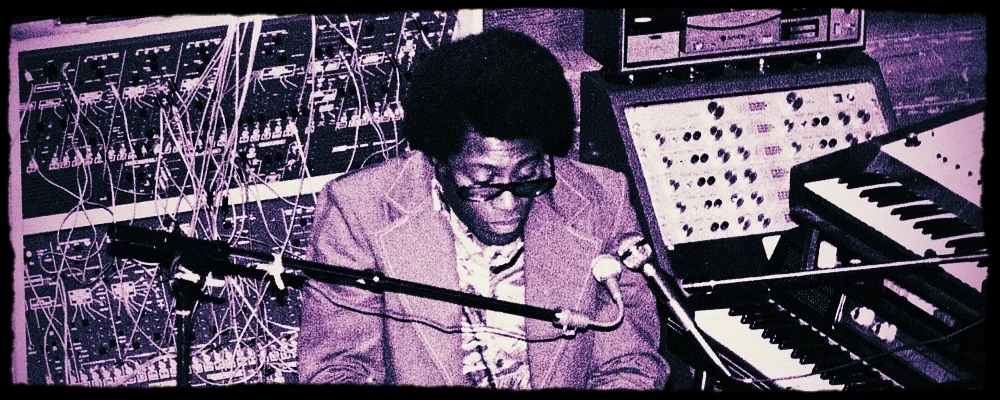 Don Lewis seated within his later Live Electronic Orchestra performance system