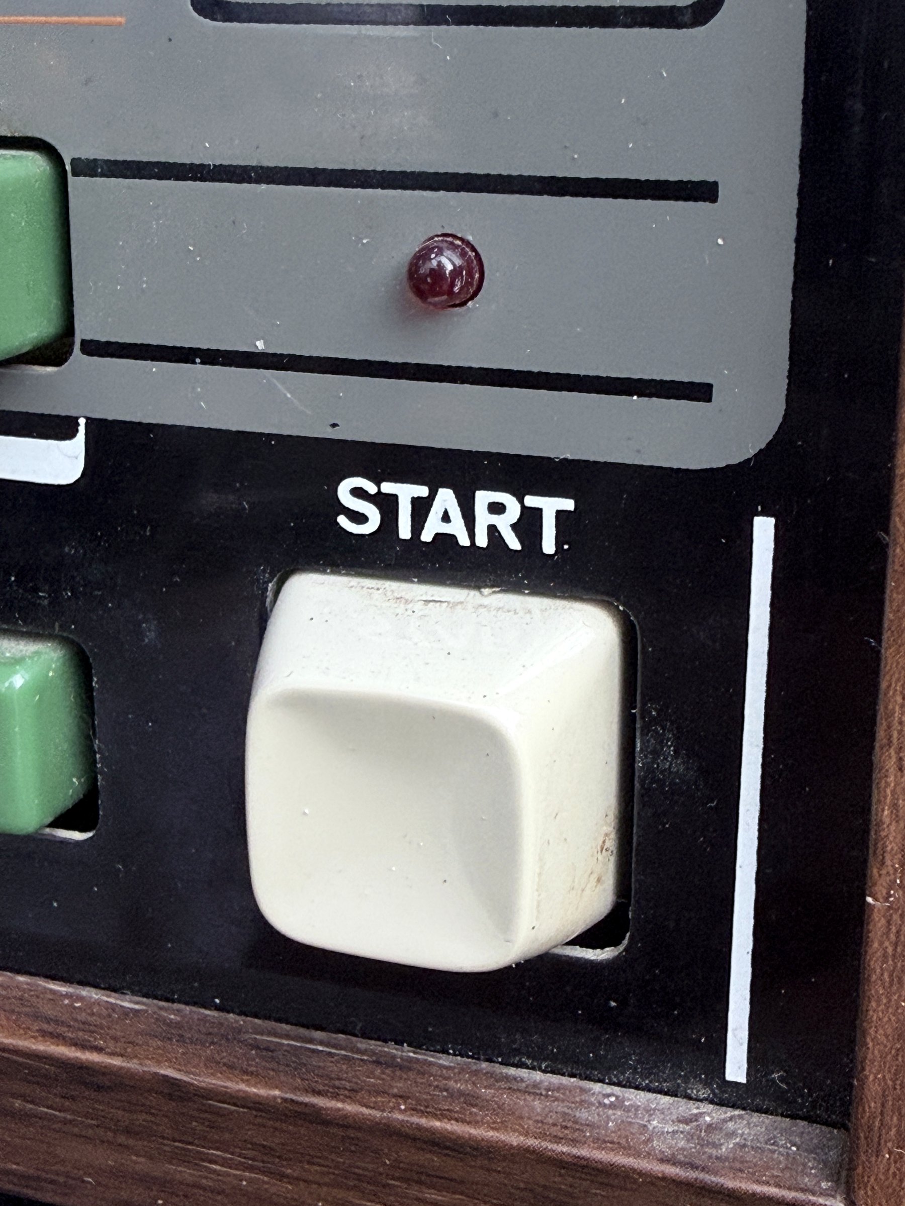 Close view of the TR-66 white start button and red tempo indicator