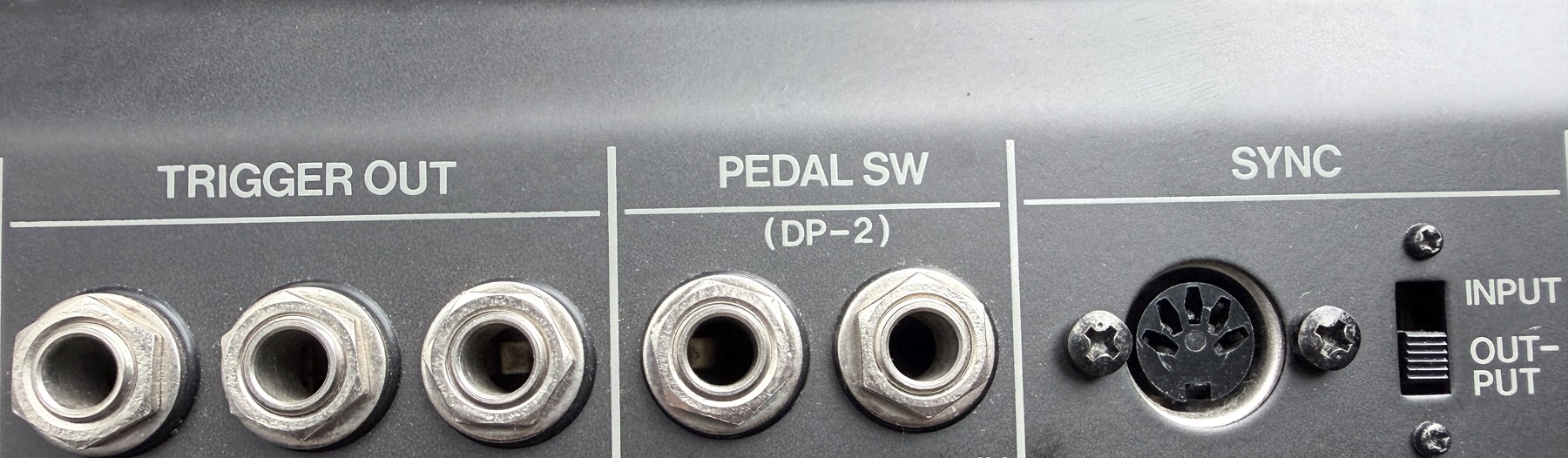 Close photograph of Cowbell, Clap and Accent trigger outputs, pedal socket and DIN Sync connector