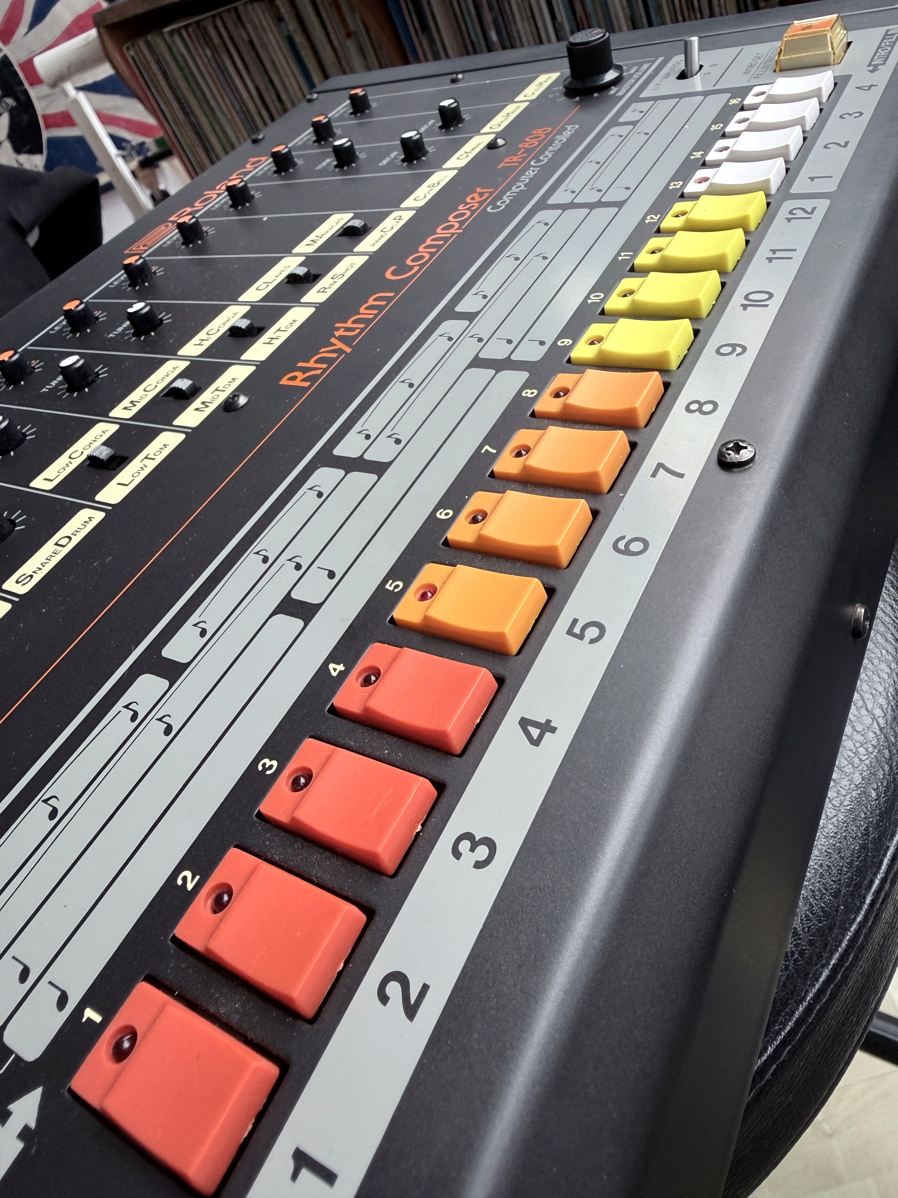 Close photograph of the TR-808's coloured keys and step-number markings