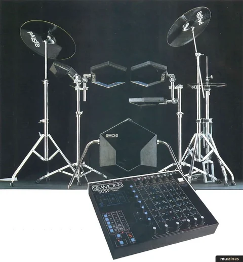 Simmons electronic kit and cymbals on stands with a separate control unit in the foreground.