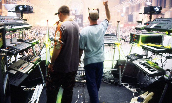 Orbital live at Alexandra Palace in 1995, seen from behind their equipment racks.