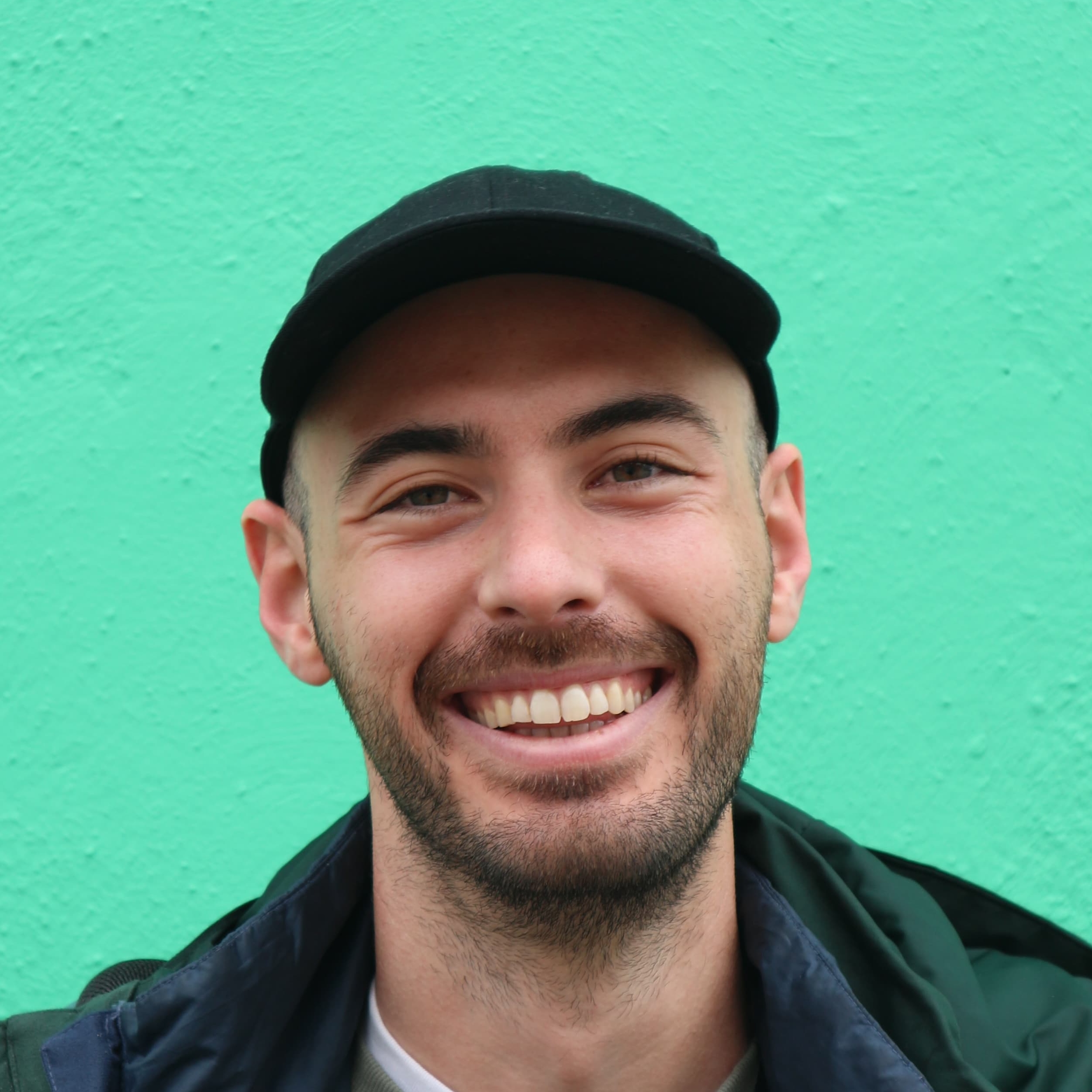 José Ramón “Bibiki” García photographed against a turquoise wall.