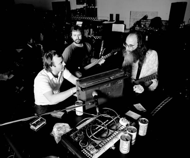 Phil Collins and Leland Sklar in a studio photograph.